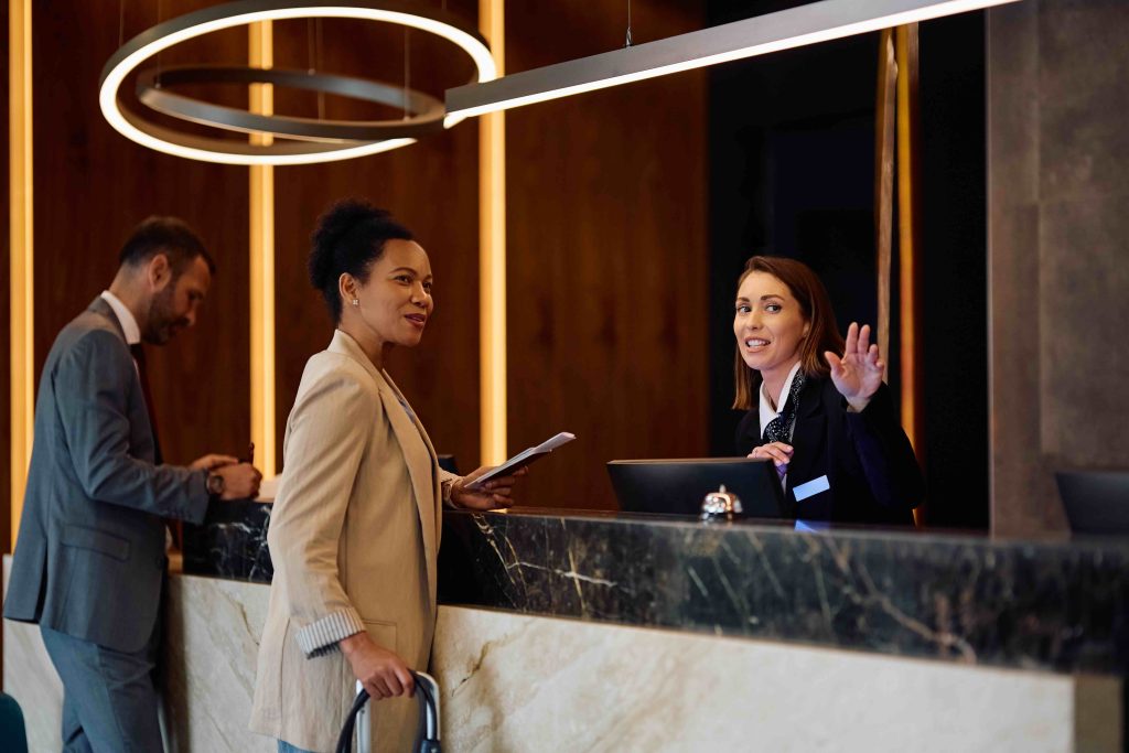 Guests checking in at a hotel reception