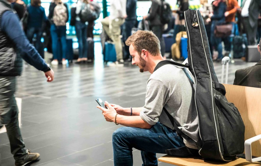A delegate travelling to the show, reading a WhatsApp reminder on their phone