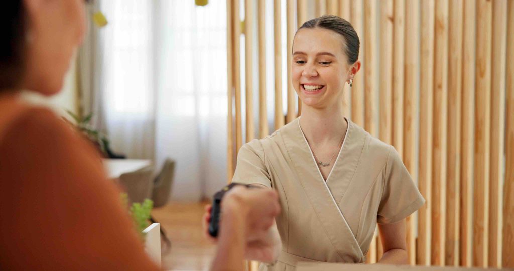 A customer being welcomed at a leisure reception