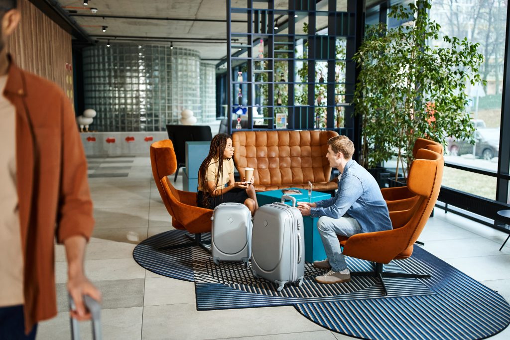 Guests comparing options on their phones in a hotel lounge